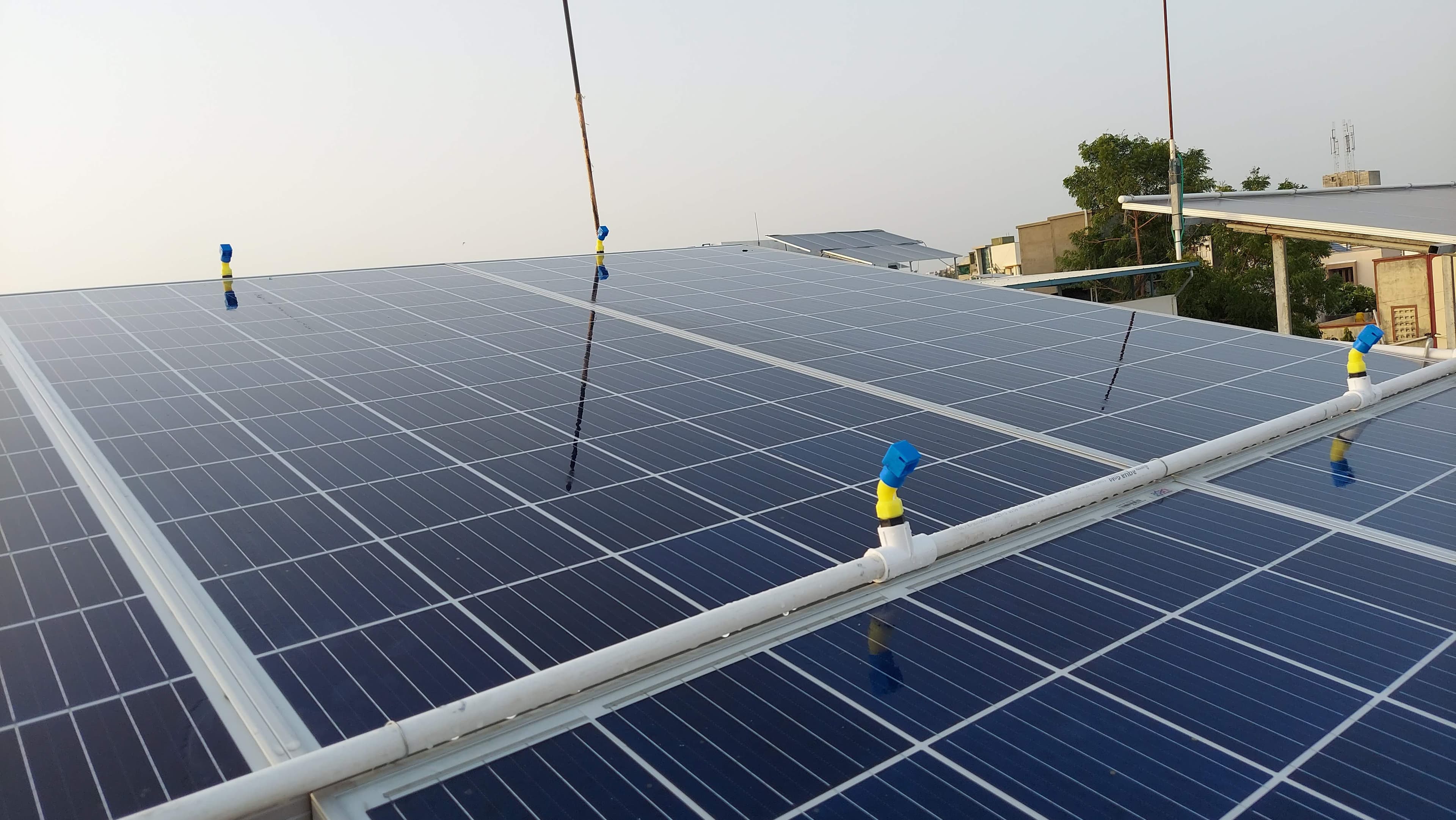 Automated sprinkler cleaning system for solar panels
